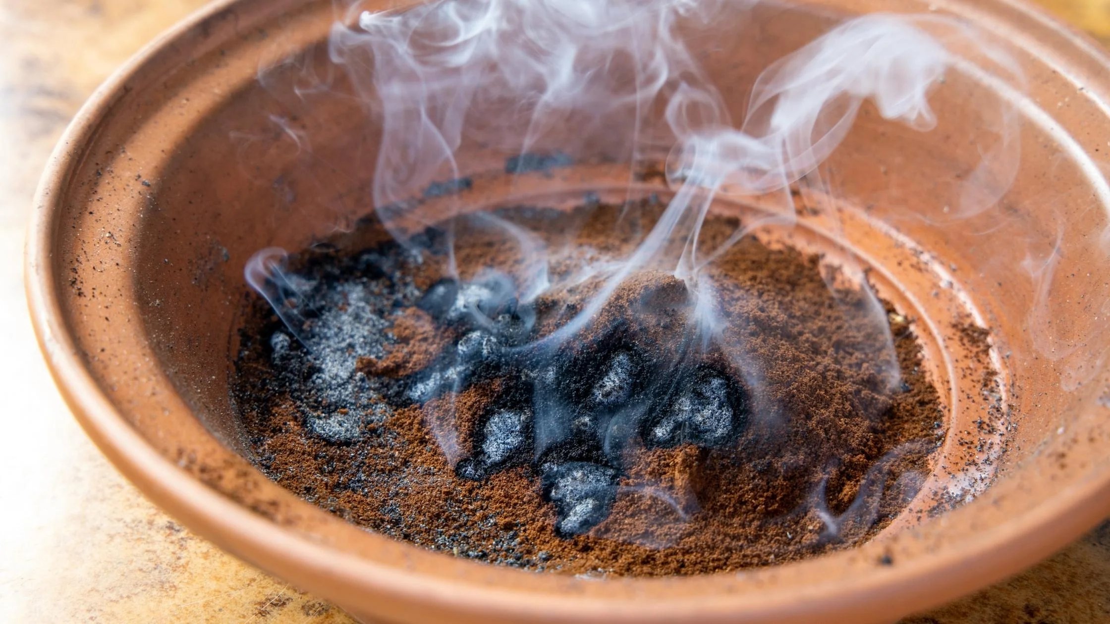 burning-coffee-grounds  as mosquito repellent